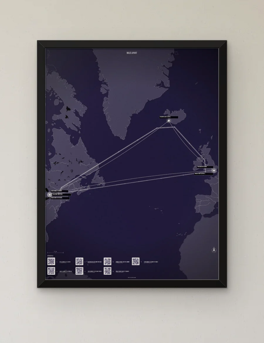 The Map, framed in black, hung on a plaster wall